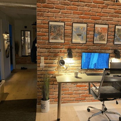 Scandyna white MNP loudspeakers placed with PC in stylish office