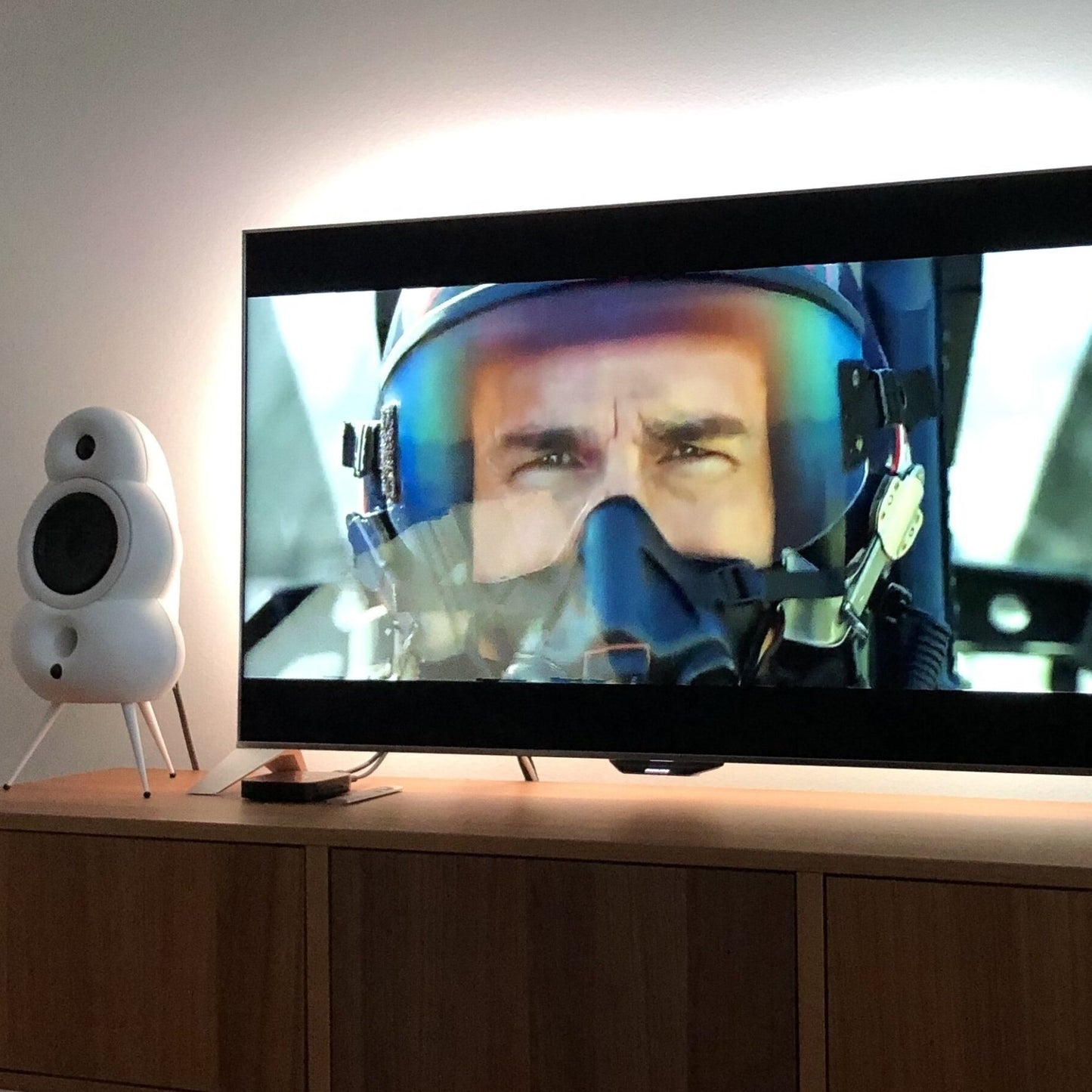 Scandyna TV Pack, white speakers with Philips TV showing Hollywood Blockbuster movie Top Gun with Tom Cruise starring. 